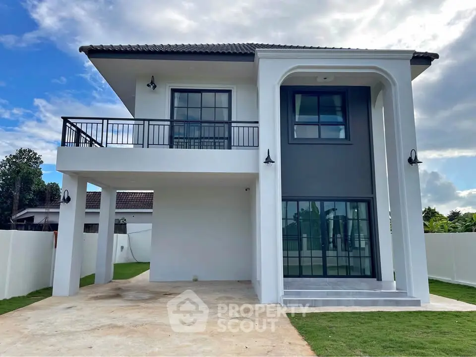 Modern two-story house with sleek design and spacious driveway