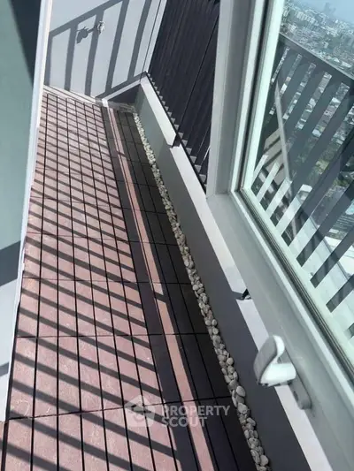 Modern balcony with sleek railing and city view, perfect for urban living.