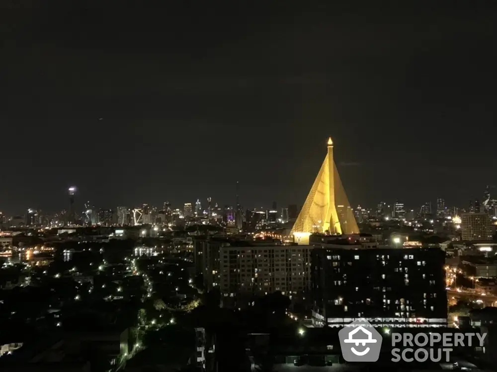 Stunning nighttime cityscape with iconic illuminated architecture and skyline views.