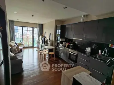 Modern open-layout kitchen and living room with city view, sleek cabinetry, and hardwood floors.