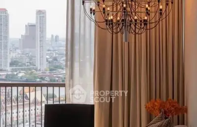 Luxurious living room with elegant chandelier and stunning city view