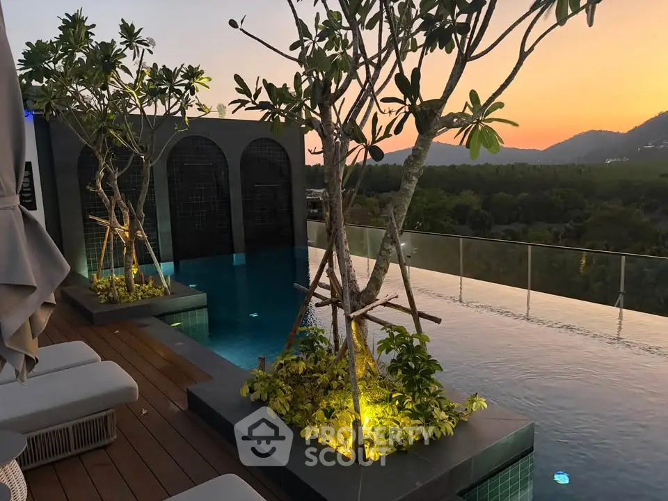 Luxurious rooftop infinity pool with stunning sunset views and lush greenery.