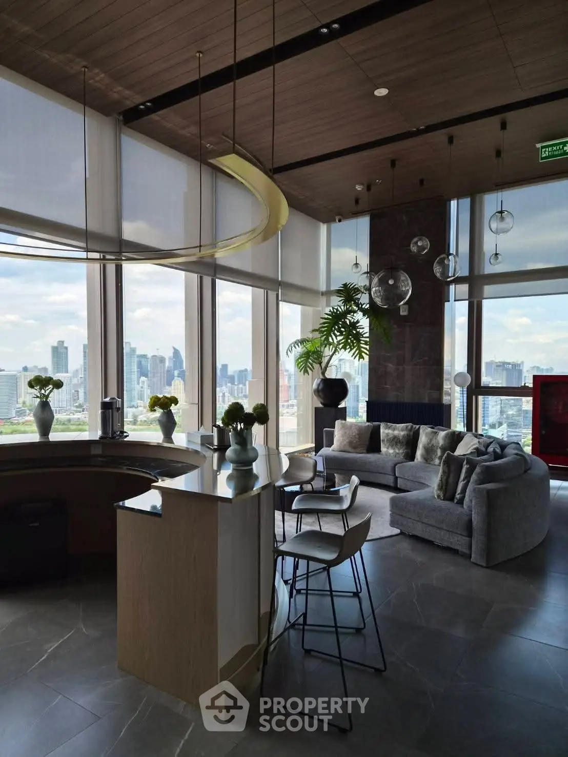 Luxurious modern living room with panoramic city views and elegant furnishings.