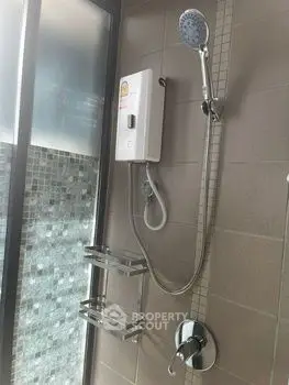 Modern bathroom shower with sleek fixtures and glass partition