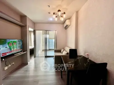 Modern living room with stylish lighting and sleek furniture in a contemporary apartment.
