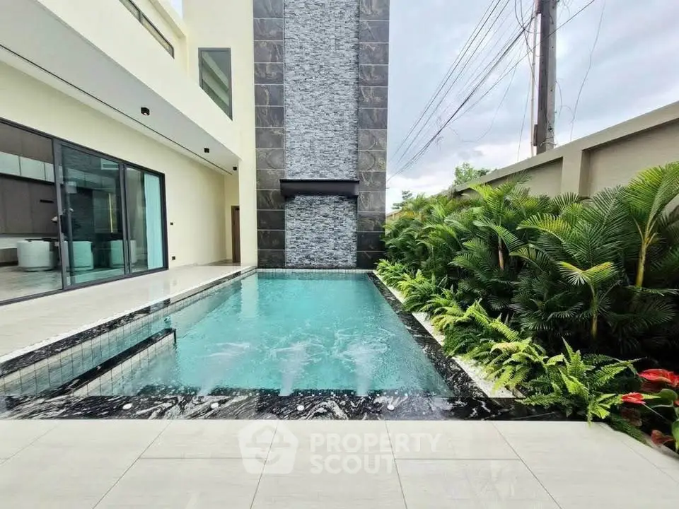 Luxurious modern home with private pool and lush garden, perfect for relaxation and entertainment.