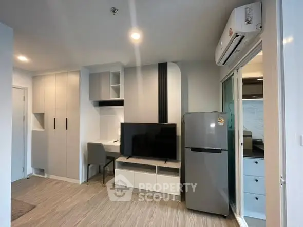 Modern living room with sleek furniture and integrated kitchen area