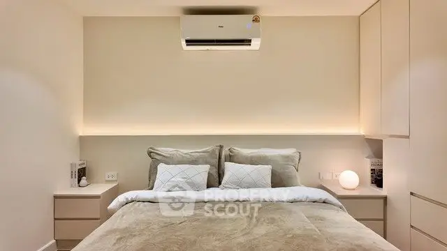 Cozy modern bedroom with neutral tones and ambient lighting
