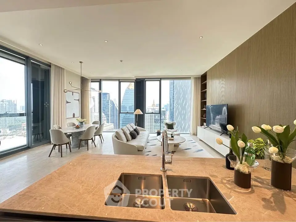 Luxurious open-plan living room with stunning city view and modern decor