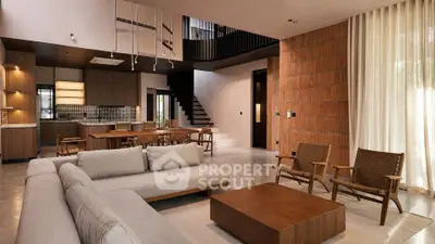 Luxurious open-plan living room with modern furniture and stylish kitchen in elegant home.