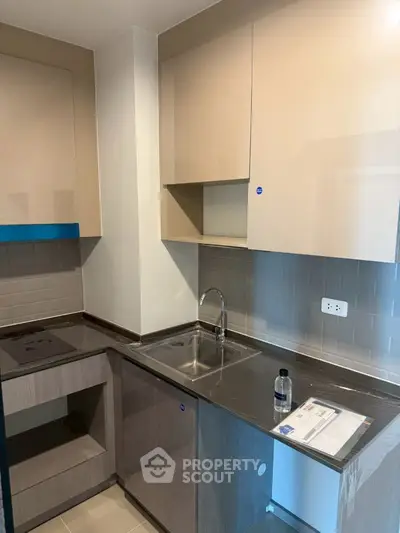 Modern kitchen with sleek cabinetry and built-in appliances
