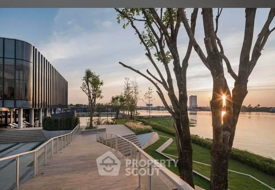 Stunning riverside property with modern architecture and scenic sunset view.