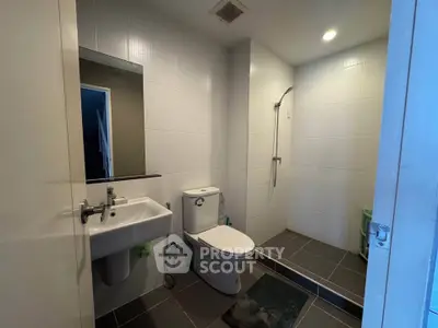 Modern bathroom with sleek fixtures and walk-in shower