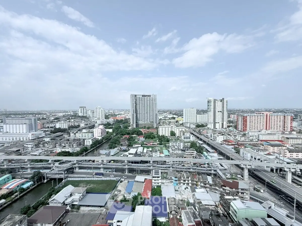 Stunning cityscape view from high-rise building showcasing urban living and modern architecture.