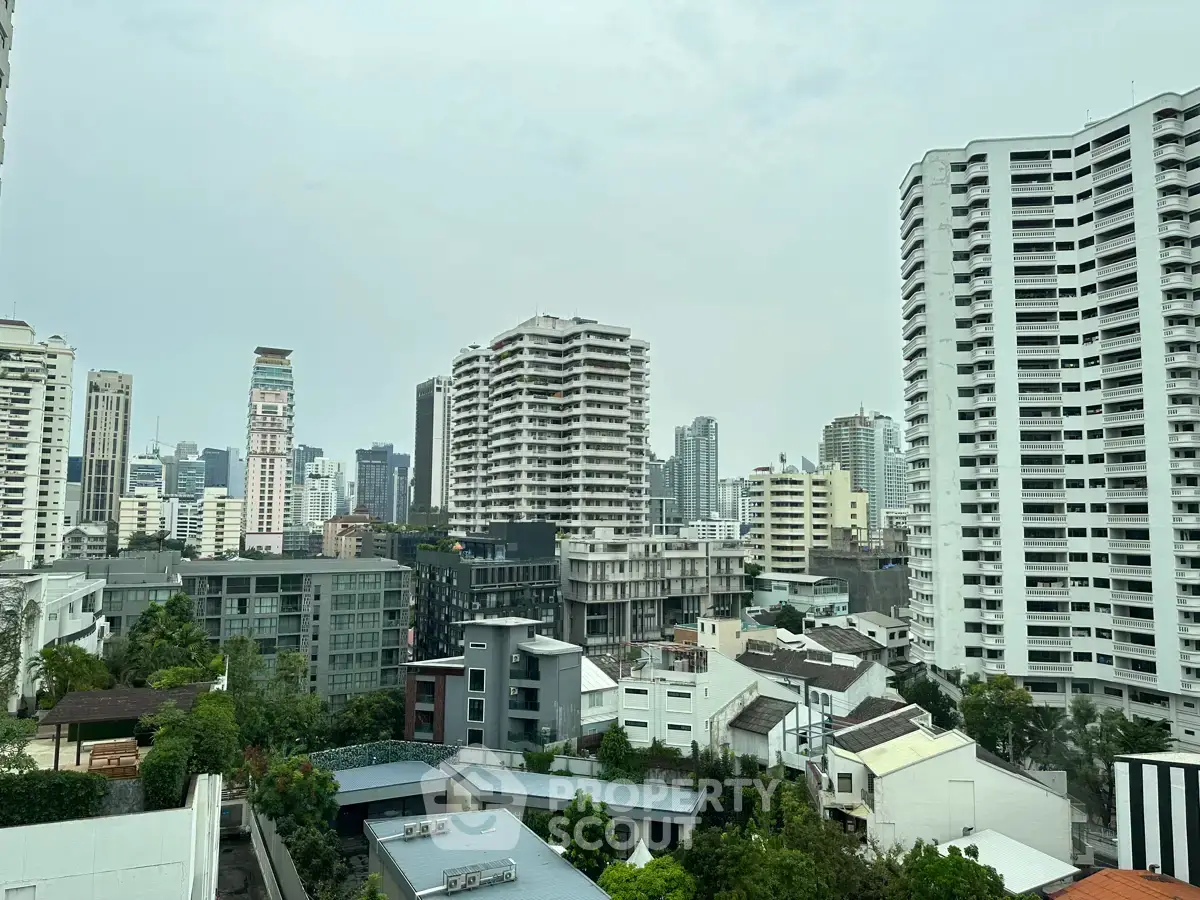 Stunning cityscape view showcasing modern high-rise buildings and lush greenery, perfect for urban living.