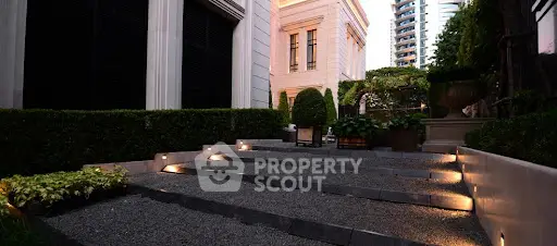 Luxurious garden pathway with ambient lighting in upscale residential area