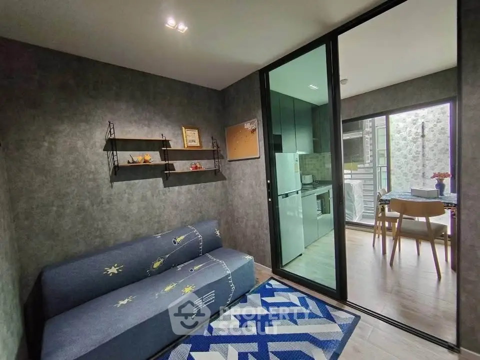 Modern living room with stylish decor and open kitchen layout in a contemporary apartment.