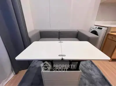 Modern compact living room with convertible table and washing machine