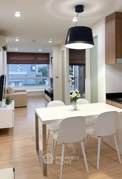 Modern open-plan living and dining area with stylish decor and natural light