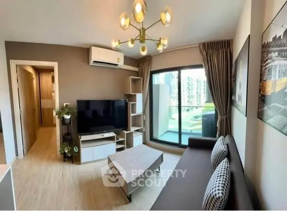 Modern living room with stylish decor and balcony view in urban apartment