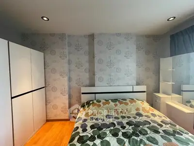 Cozy bedroom with modern decor and ample storage space