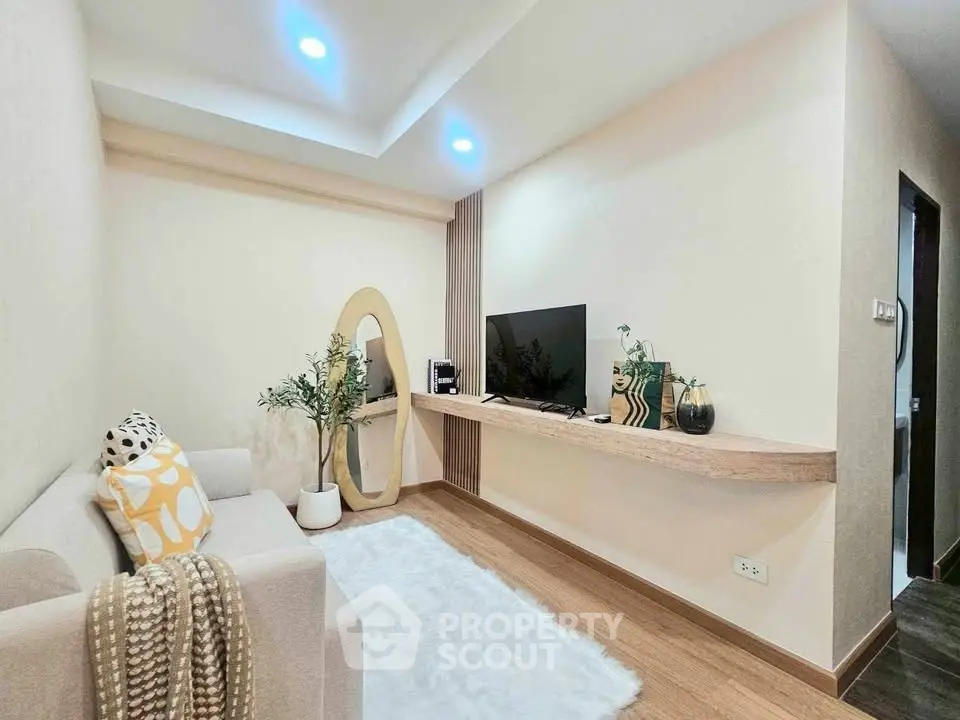 Cozy modern living room with stylish decor and wooden flooring