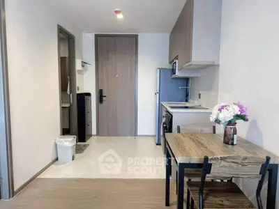 Modern compact kitchen with dining area in stylish apartment