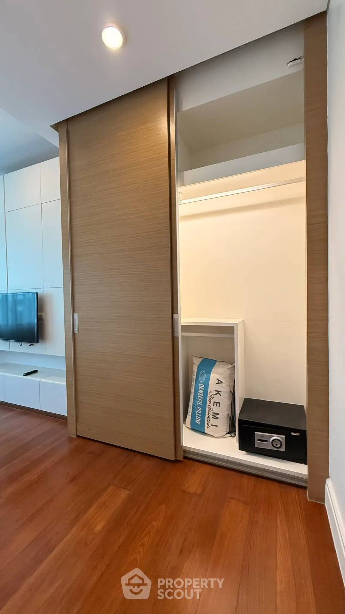 Modern apartment with wooden flooring and built-in storage closet