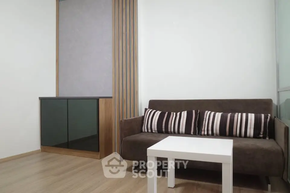 Modern living room with stylish sofa and sleek cabinet design