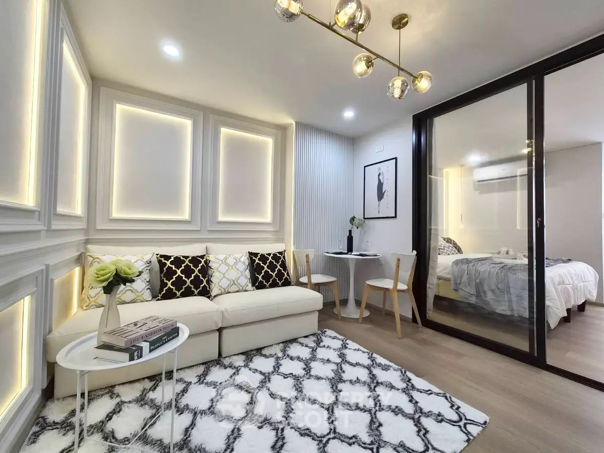 Modern living room with elegant decor and cozy bedroom view