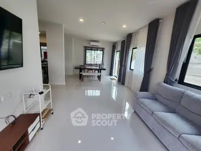 Spacious modern living room with sleek design and abundant natural light