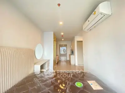 Modern bedroom with air conditioning and stylish decor in a contemporary apartment.