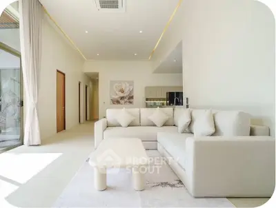 Spacious modern living room with elegant sofa and natural light