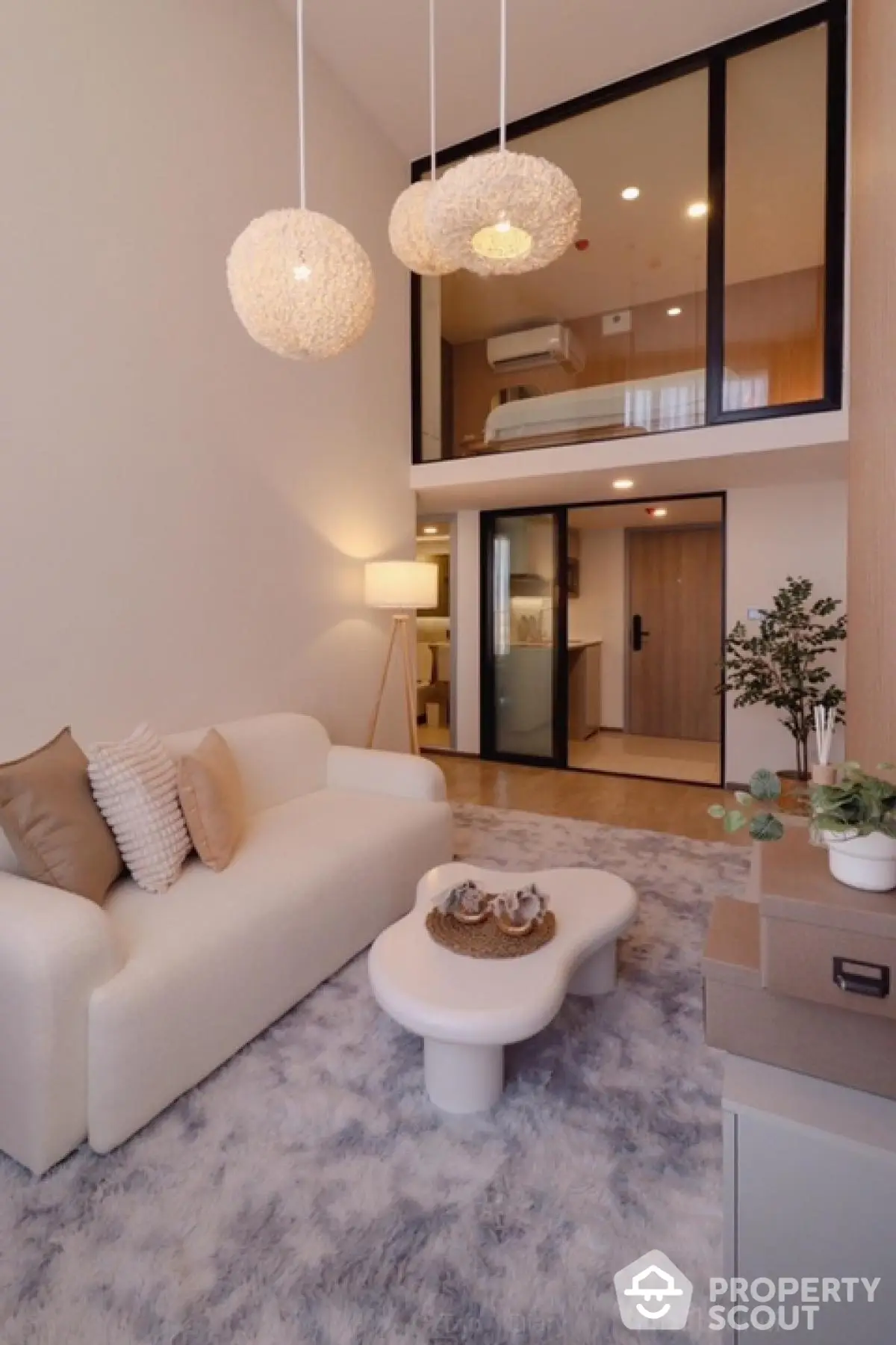 Modern loft-style living room with high ceiling and elegant decor