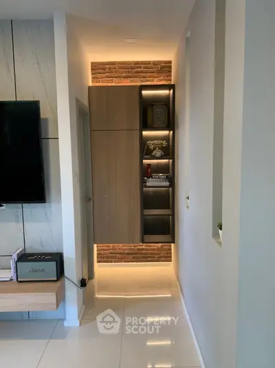 Modern living room with sleek cabinetry and ambient lighting