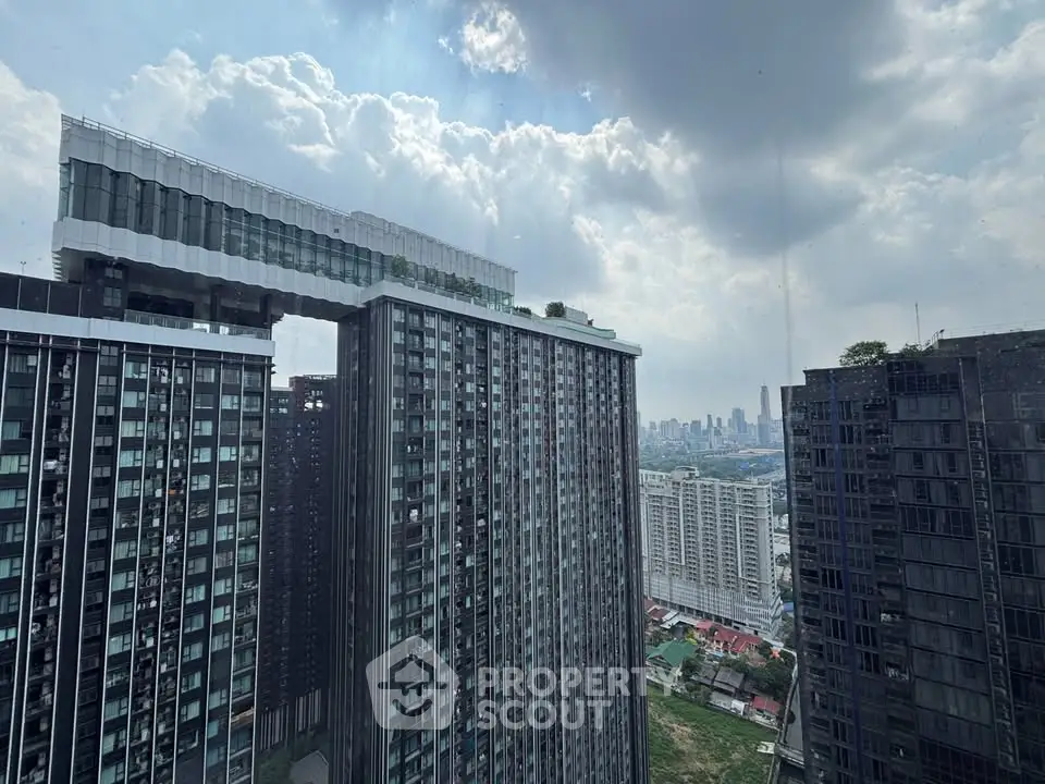 Stunning cityscape view from a high-rise building with modern architecture and expansive skyline.