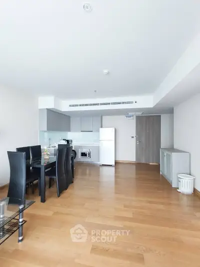 Spacious modern living room with dining area and kitchen in open layout