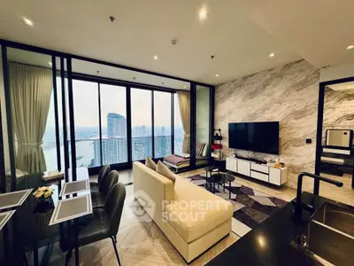 Luxurious living room with stunning city view, modern decor, and spacious layout in high-rise apartment.