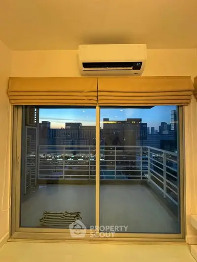 Modern apartment balcony with city view and air conditioning unit
