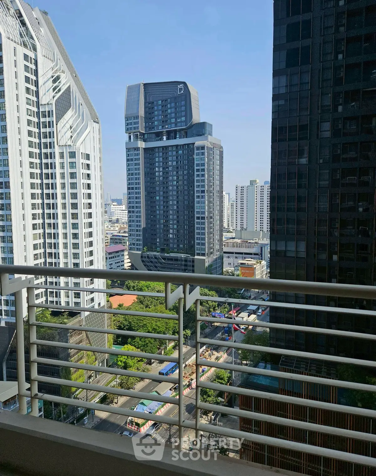 Stunning cityscape view from a high-rise balcony in urban setting