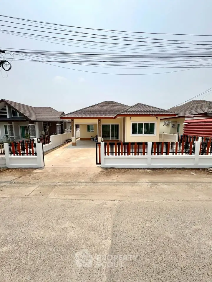 Charming single-story home with spacious driveway and modern design in a serene neighborhood.