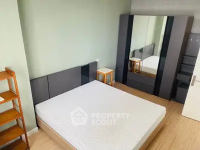 Modern bedroom with minimalist design and large wardrobe