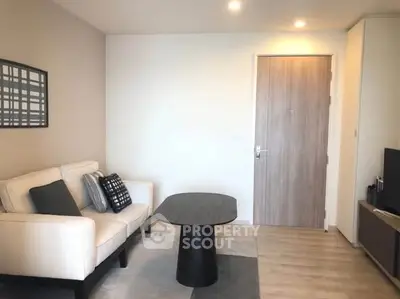 Modern living room with stylish decor and cozy seating area.