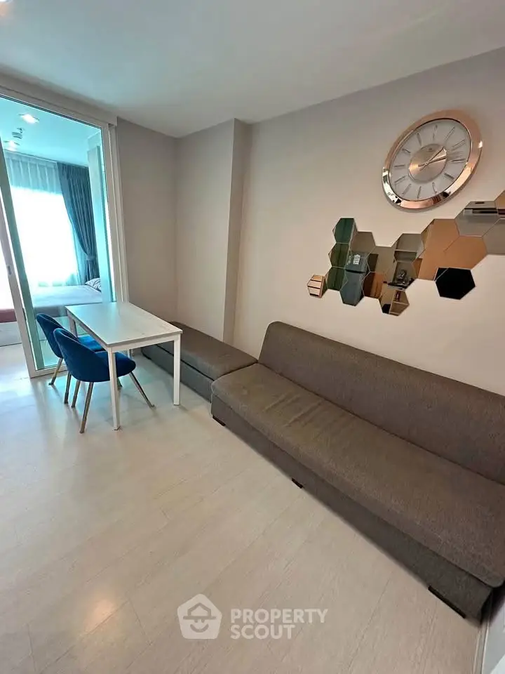 Modern living room with stylish decor and comfortable seating in a contemporary apartment.