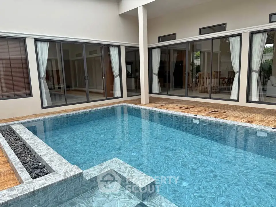 Luxurious modern home with private pool and elegant patio area, perfect for relaxation and entertainment.