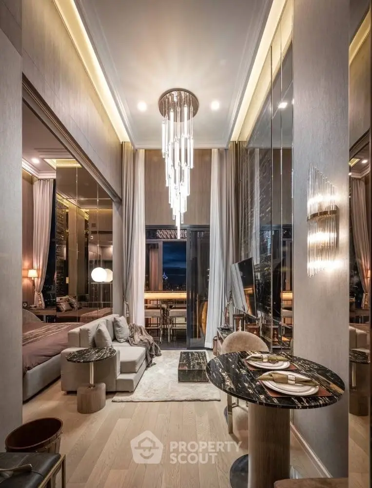 Luxurious modern living room with high ceilings and elegant chandelier