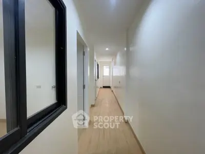 Bright and spacious hallway with modern design and wooden flooring