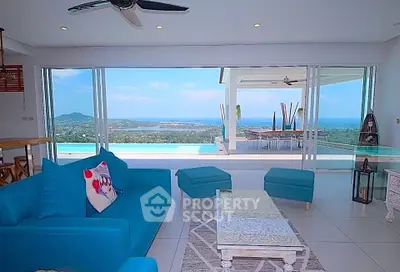 Luxurious living room with stunning ocean view and infinity pool