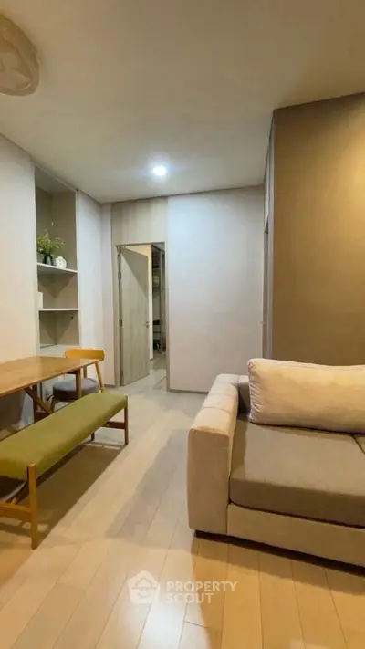 Cozy living room with modern furniture and warm lighting, perfect for relaxation and entertaining.