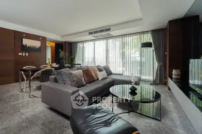 Luxurious modern living room with elegant decor and spacious seating area.